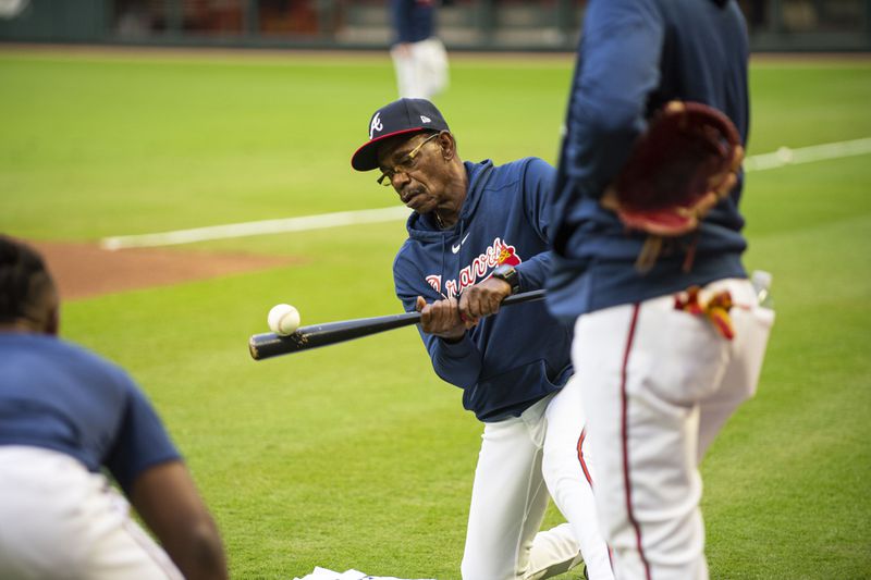 Third base coach Ron Washington hits to players during a workout Friday, October 7, 2023 at Truist Park ahead of the Braves’ NLDS series against the Phillies. (Daniel Varnado/ For the AJC)