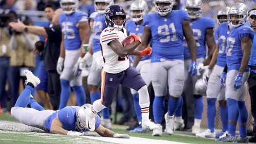 DETROIT, MI - NOVEMBER 22: Tarik Cohen #29 of the Chicago Bears runs back a kick against a diving Zach Zenner #34 of the Detroit Lions during the third quarter  at Ford Field on November 22, 2018 in Detroit, Michigan. (Photo by Leon Halip/Getty Images)
