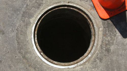 An overflow was discovered coming through a manhole in McDonough.