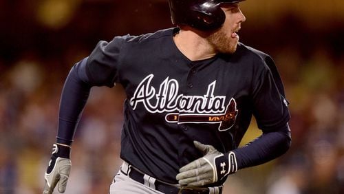 Freddie Freeman was back at first base Tuesday, his third-base days apparently over for the forseeable future. (Photo by Harry How/Getty Images)