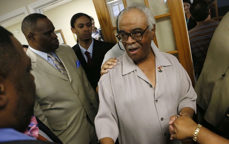 May 23, 2013 - Marietta - Family members and supporters greet Tyrone Brooks after the press conference. Former Gov. Roy Barnes holds a press conference on behalf of his latest high-profile client -- indicted state Rep. Tyrone Brooks, D-Atlanta, at his Marietta law office on Thursday. In a federal indictment, Brooks was charged with tax, wire and mail fraud. BOB ANDRES / BANDRES@AJC.COM