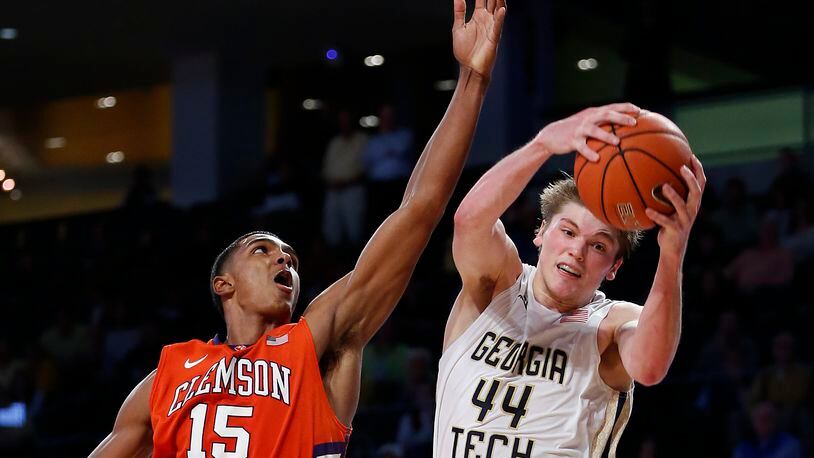 Georgia Tech center Ben Lammers (44) comes down with a rebound against Clemson forward Donte Grantham (15) during the second half of an NCAA college basketball game Tuesday, Feb. 23, 2016, in Atlanta. Georgia Tech won 75-73. (AP Photo/John Bazemore)