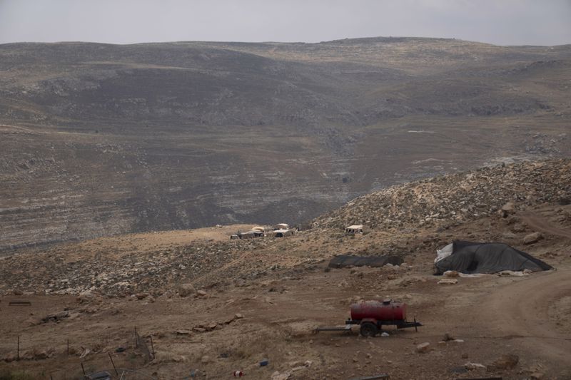 Bedouins fled their homes on the far hillside seen in the background following a wave of attacks by Israeli settlers, Tuesday, April 30, 2024. (AP Photo/Nasser Nasser)
