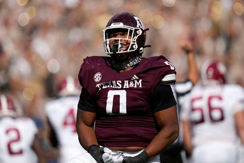 FILE - Texas A&M defensive lineman Walter Nolen (0) reacts after sacking Alabama quarterback Jalen Milroe (4) during the first half of an NCAA college football game Saturday, Oct. 7, 2023, in College Station, Texas. Nolen arrived at Mississippi from Texas A&M as one of the top-rated transfers and bolsters an experienced defensive front. The former five-star recruit started 14 games in two seasons with the Aggies and had four sacks last season. (AP Photo/Sam Craft, File)