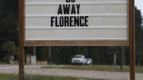 A sign reads "Go Away Florence" ahead of the arrival of Hurricane Florence  to the Carolinas. Several birds were blown off a vehicle due to high winds Thursday,