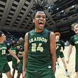 Grayson's Gicarri Harris (24) celebrates with teammates after Grayson beat McEachern to win GHSA Basketball Class 7A Boy’s State Championship at the Macon Centreplex, Saturday, Mar. 9, 2024, in Macon. Grayson won 51-41 over McEachern. (Hyosub Shin / Hyosub.Shin@ajc.com)