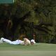 Matt Fitzpatrick lays on the ground to get a better perspective before his putt on 18th hole during second round of the 2024 Masters Tournament at Augusta National Golf Club, Friday, April 12, 2024, in Augusta, Ga. Jason Getz / Jason.Getz@ajc.com)
