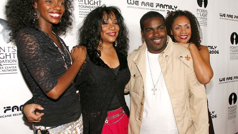 This Aug. 14, 2006, file photo shows Joni Sledge, one of the original members of Sister Sledge, second from left, posing with Rodney Jerkins, second from right, her niece Camille Sledge, left, and her cousin Amber Sledge at the "We Are Family 2006 - All-Star Katrina Benefit CD and Documentary DVD Launch" in Century City, Calif. Sledge, who with her sisters recorded the defining dance anthem "We Are Family," has died, the band's representative says. She was 60. Sledge was found dead in her home by a friend in Phoenix, Arizona, on March 10, the band's publicist, Biff Warren, said.  (AP Photo/Chris Polk, File)