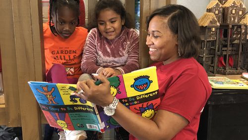 A volunteer with the nonprofit Everybody Wins! Atlanta reads to students. For 25 years, the organization has been dedicated to helping students who struggle with reading. Courtesy of Everybody Wins! Atlanta