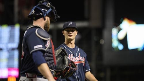 Braves pitcher Mike Soroka talks with catcher Brian McCann  as they head to the dugout May 9, 2019, at Chase Field in Phoenix, Ariz.