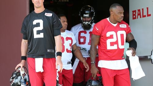 Falcons quarterback Matt Ryan (left) and cornerback Phillip Adams (right) take the field for the first day of training camp on Friday, July 31, 2015, in Flowery Branch. Adams has been identified as the gunman who killed five people in South Carolina on April 7, 2021, before turning the gun on himself. Curtis Compton / ccompton@ajc.com
