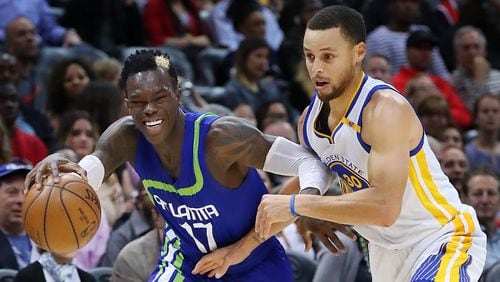 Atlanta Hawks guard Dennis Schroder takes it to the basket battling Golden State Warriors guard Stephen Curry on his way to two of his 19 first period points in a NBA basketball game on Monday, March 6, 2017, in Atlanta. Curtis Compton/ccompton@ajc.com