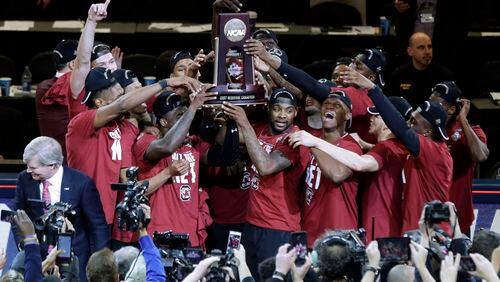 South Carolina players celebrate after beating Florida 77-70 in the East Regional championship game on Sunday, March 26, 2017, in New York. (AP Photo/Frank Franklin II)