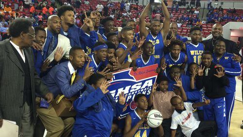 The Wilkinson County boys celebrate the program's second straight title.