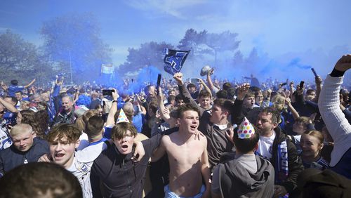 Ipswich Town fans react, ahead of the English Championship soccer match between Ipswich Town and Huddersfield Town at Portman Road, in Ipswich, Saturday, May 4, 2024. (Zac Goodwin/PA via AP)