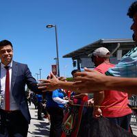 Atlanta United head coach Gonzalo Pineda smiles as he high-fives fans during the team’s arrival at Mercedes-Benz Stadium moments before the team faces the Philadelphia Union on Sunday, April 14, 2024.  Miguel Martinez / miguel.martinezjimenez@ajc.com