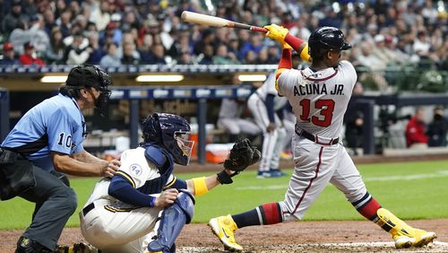 Atlanta Braves' Ronald Acuna Jr. hits an RBI single during the fifth inning of a baseball game against the Milwaukee Brewers Tuesday, May 17, 2022, in Milwaukee. (AP Photo/Morry Gash)