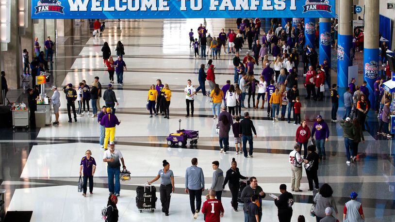 High-profile sports events are a foundation of Atlanta’s hospitality sector. Here, fans enter the Georgia World Congress Center for the Chick-fil-A Peach Bowl FanFest in 2019. STEVE SCHAEFER / SPECIAL TO THE AJC