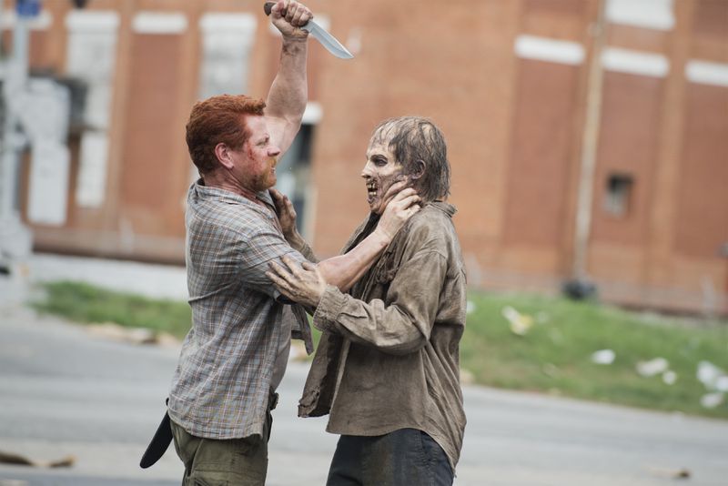  Abraham goes after a zombie as he and his group try to get their way to D.C. CREDIT: AMC