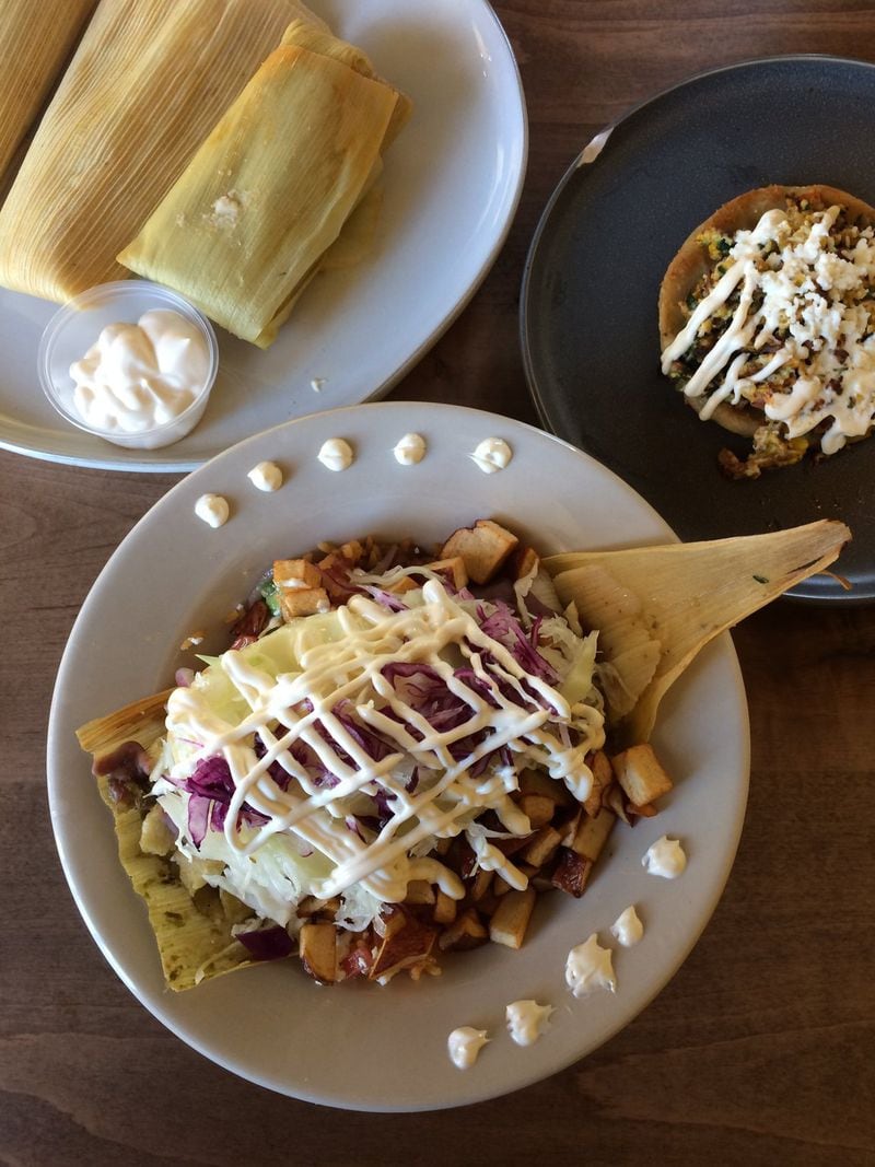 At La Mixteca in Suwanee: a spread of unshucked tamales (upper left), picaditas (right) and a tamale bowl (bottom). CONTRIBUTED BY WENDELL BROCK