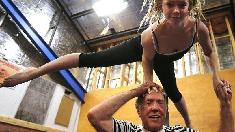 Acrobat Steve Seaberg, 85, practices a routine with the much younger Nova Hawkins, 24, for some upcoming events with the Imperial OPA Circus at Buck’s Sport Barn on May 17, 2016, in Atlanta. CURTIS COMPTON / CCOMPTON@AJC.COM