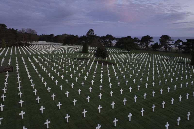 This photo taken on Wednesday April 10, 2024, shows crosses of the US cemetery of Colleville-sur-Mer, Normandy. On D-Day, Charles Shay was a 19-year-old Native American army medic who was ready to give his life — and actually saved many. Now 99, he's spreading a message of peace with tireless dedication as he's about to take part in the 80th celebrations of the landings in Normandy that led to the liberation of France and Europe from Nazi Germany occupation. (AP Photo/Thibault Camus)