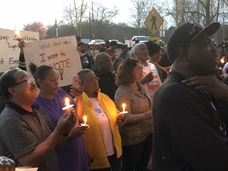 About 100 people turned out for a city of Stockbridge candlelight prayer vigil Monday. The Henry County city is fighting an effort by Eagle’s Landing, a wealthy Stockbridge community, to break away and form its own city.