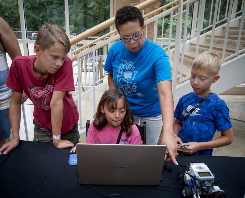 Nichelle Mathur, director of Robotic Explorers, teaches kids how to program robots during Robots Day at the Fernbank Museum of Natural History on Saturday, June 23, 2018. (STEVE SCHAEFER / SPECIAL TO THE AJC)