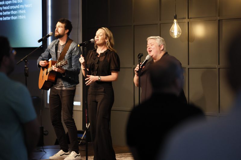 Left to right, Joe Davis, Katie Deese, and Leah Lindsay perform at the beginning of the service at Vinings Lake Church on March 17, 2024. Miguel Martinez /miguel.martinezjimenez@ajc.com
