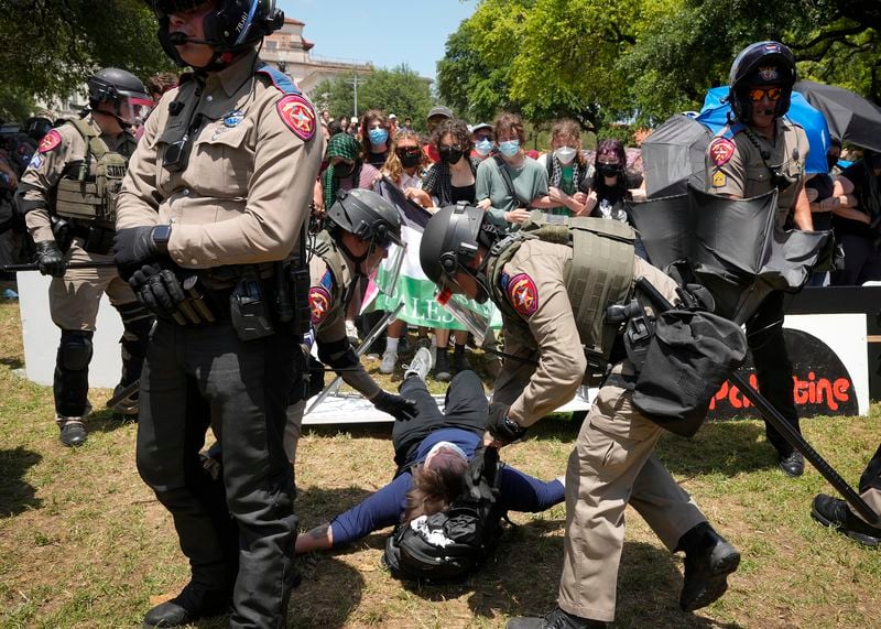 State troopers arrest a person at a pro-Palestinian protest at the University of Texas in Austin, Texas, Monday, April 29, 2024. (Jay Janner/Austin American-Statesman via AP)