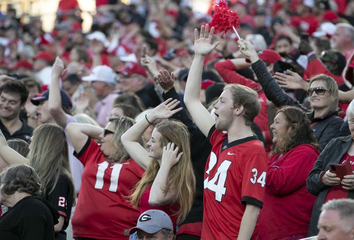 Georgia fans do the Braves chop and chant during the second half of the annual NCAA  Georgia vs Florida game at TIAA Bank Field in Jacksonville. Georgia won 34-7.  Bob Andres / bandres@ajc.com