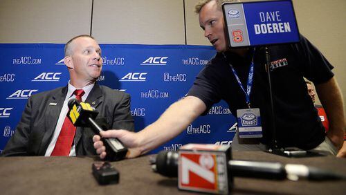 NC State head coach Dave Doeren is interviewed by WTVD's Mark Armstrong during the 2017 ACC Football Kickoff media event in Charlotte, N.C., Thursday, July 13, 2017. (Photo by Sara D. Davis, the ACC.com)