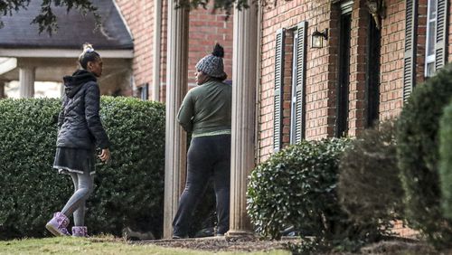 Deonna Bray, right, and Jada Miller wait on news on Bray’s missing son, 1-year old Blaise Barnett, who was taken Nov. 10 when his family's car was stolen from outside a Clarkston apartment. (JOHN SPINK / JOHN.SPINK@AJC.COM)