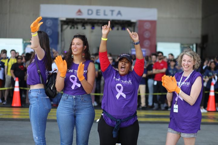 Part of the team "Hope Thrives" reacts as they are ready to take a position to pull the 757 airplane during the fundraising Relay for Life and Jet Drag event on Wednesday, May 4, 2022. Miguel Martinez /miguel.martinezjimenez@ajc.com