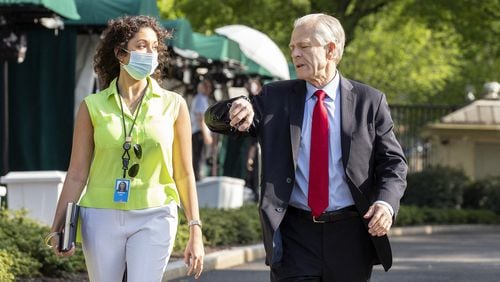 Peter Navarro, director of trade and industrial policy and director of the White House National Trade Council, right, speaks to a staff member following a television interview on Friday, May 15, 2020 at the White House in Washington D.C. (Stefani Reynolds/CNP/Abaca Press/TNS)