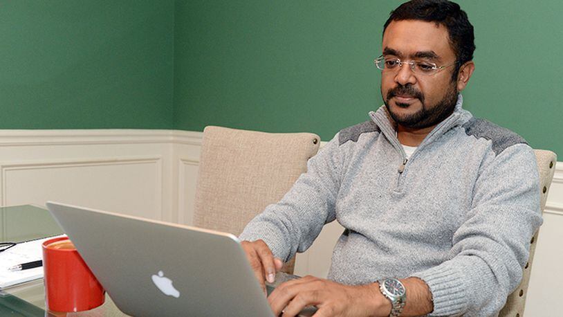 Shuaib Hanief, who runs the AtlantaMuslim.com website, works at his Lawrenceville home. Hanief says he works hard to make the site a place where members of the Muslim community in Atlanta can share their views.