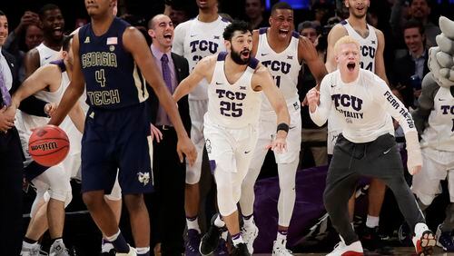TCU celebrates as Georgia Tech’s Norman Harris (4) brings the ball down the court as time runs out in the second half of an NCAA college basketball game in the final of the NIT Thursday, March 30, 2017, in New York. (AP Photo/Frank Franklin II)