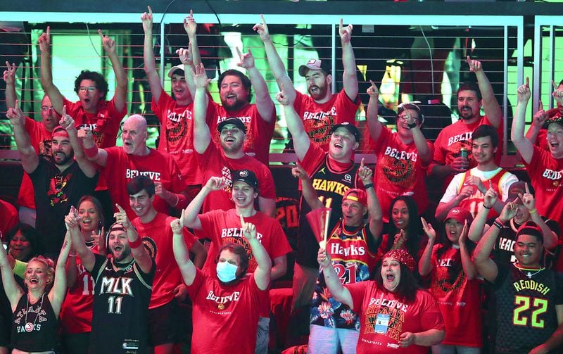 Hawks fans cheer their team taking the court to play the Milwaukee Bucks in Game 6 of the NBA Eastern Conference Finals on Saturday, July 3, 2021, in Atlanta.   (Photo by Curtis Compton / Curtis.Compton@ajc.com)
