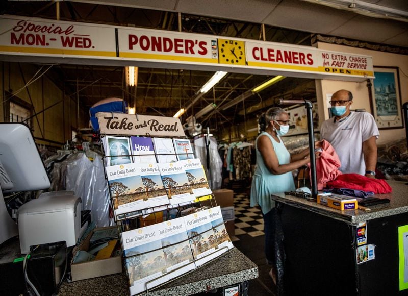 Bible tracks are displayed at Ponder's Cleaners as owners Deborah Ponder, left, and her husband, Roderick Ponder, sort through clothing at their business in Atlanta, Saturday, June 13, 2020. BRANDEN CAMP FOR THE ATLANTA JOURNAL-CONSTITUTION