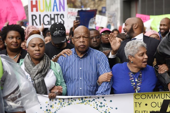 John Lewis embraced at Atlanta march following Trump feud