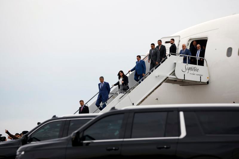 Officials from Iraq traveling with Prime Minister Mohammed Shia al-Sudani arrive at Detroit Metro Airport in Detroit, Thursday, April 18, 2024. (AP Photo/Al Goldis)