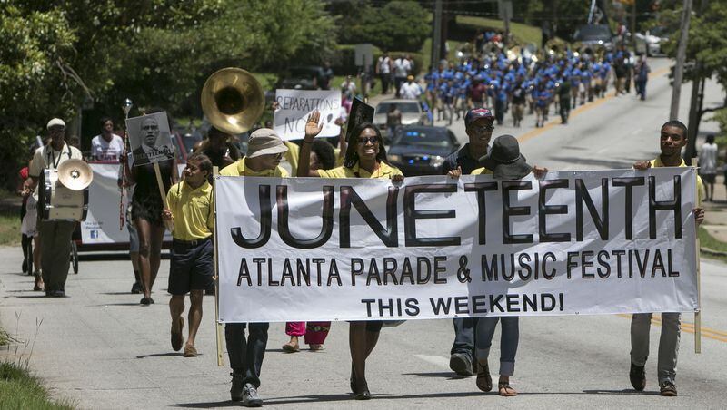 JUNE 13, 2015-ATLANTA: The Juneteenth Parade makes it's way down Martin Luther Drive in Atlanta on Saturday June 13th, 2013. Mozley Park was the site of the Juneteenth Festival. The four day event commemorated 150 years of African American achievements & calls on freedom and prosperity for all people, according the it's website. (Photo by Phil Skinner)