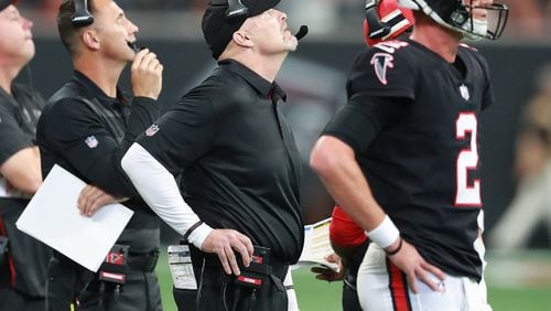 September 30, 2018 Atlanta: Falcons offensive coordinator Steve Sarkisian (from left), head coach Dan Quinn, and quarterback Matt Ryan can only watch from the sidelines in the fourth quarter falling to the Bengals 37-36 in a NFL football game on Sunday, Sept 30, 2018, in Atlanta.   Curtis Compton/ccompton@ajc.com