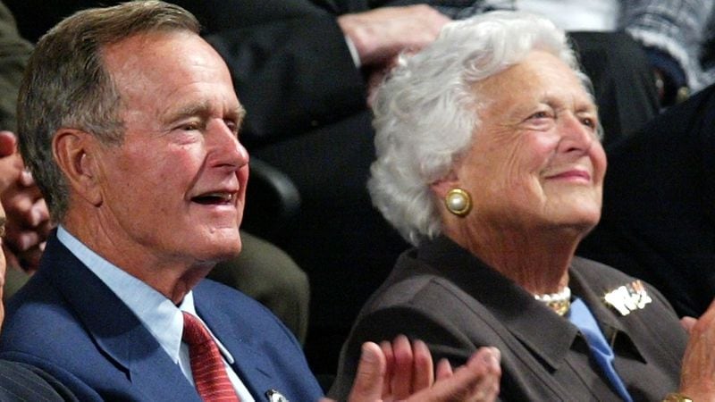 Former President George H.W. Bush and former First Lady Barbra Bush pictured in 2004. Engraved seats at NRG Stadium in Houston honor the late couple.