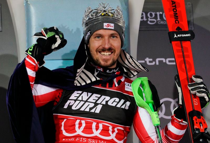 FILE - Austria's Marcel Hirscher celebrates on the podium after winning an alpine ski, men's World Cup slalom in Zagreb, Croatia, Sunday, Jan. 6, 2019. Marcel Hirscher, one of the most successful ski racers of all time, is planning to return next season after five years in retirement. And the record eight-time overall World Cup champion is going to compete for the Netherlands — his mother's country — instead of his native Austria. (AP Photo/Giovanni Auletta, File)