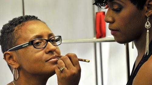 Sandy Wyckoff (left), of Fayetteville, gets a free "Kiss Kit" trial from Erin Gray, makeup artist from Fashion Fair, during the opening reception for the Macy's Ebony and Fashion Fair Retrospective Honoring Eunice Johnson at Macy's Lenox Square in Atlanta on Thursday, Feb. 24, 2011. By 2019, the cosmetic brand was bankrupt. It was purchased in 2019 by Desiree Rogers and Cheryl Mayberry McKissack, who reformulated, redesigned and relaunched the brand which is now available in Sephora stores and online at Fashionfair.com. (Hyosub Shin / Hyosub Shin@ajc.com)