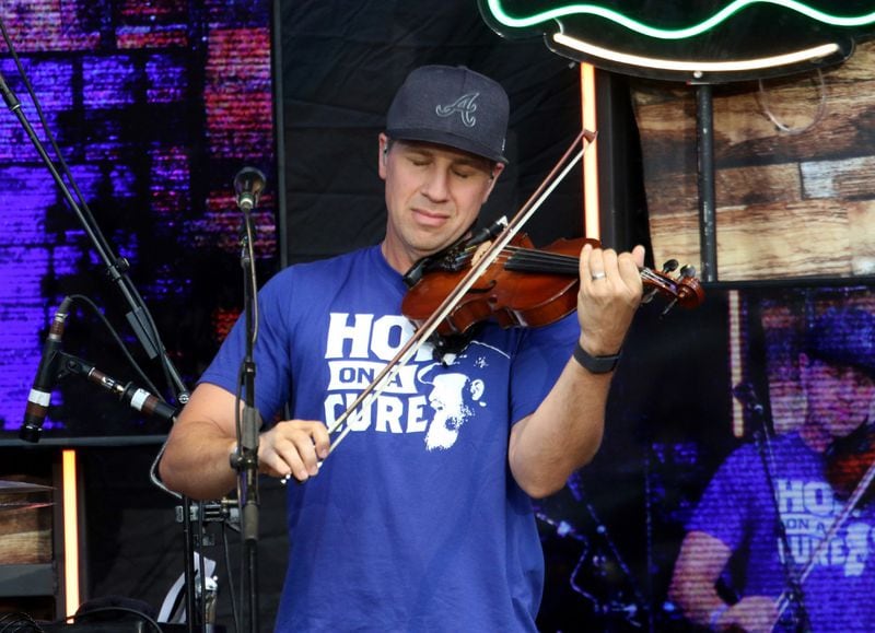 Jimmy De Martini, Zac Brown Band fiddler, at Truist Park Friday, June 17, 2022 on their Out in the Middle tour.
Robb Cohen for the Atlanta Journal-Constitution