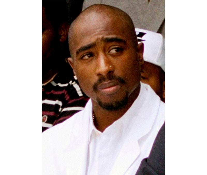 FILE - Rapper Tupac Shakur attends a voter registration event in South Central Los Angeles, Aug. 15, 1996. The defense attorney representing a former Los Angeles-area gang leader accused of killing hip-hop music icon Tupac Shakur in 1996, in Las Vegas, said Tuesday, April 23, 2024, his client's accounts of the killing are fiction and prosecutors lack key evidence to obtain a murder conviction. (AP Photo/Frank Wiese, File)