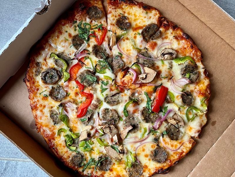 You can get a seekh kabab sausage pizza at Tandoori Pizza and Wing Co. Henry Hollis for The Atlanta Journal-Constitution