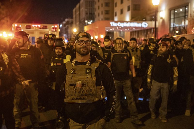 Enrique Tarrio, leader of the Proud Boys, leads a contingent of the group in Washington, Dec. 12, 2020. (Victor J. Blue/The New York Times)